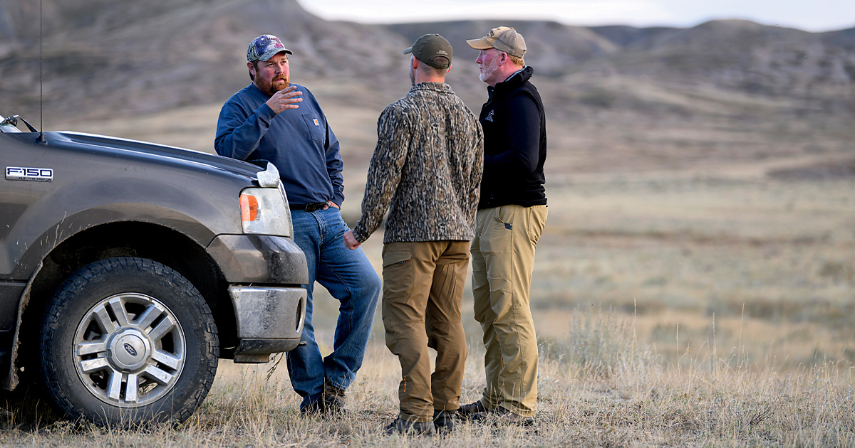 Landowner Brian Fox meets with Adam McDaniel and DU Conservation Specialist Cody Pugh. Photo by Bill Buckley