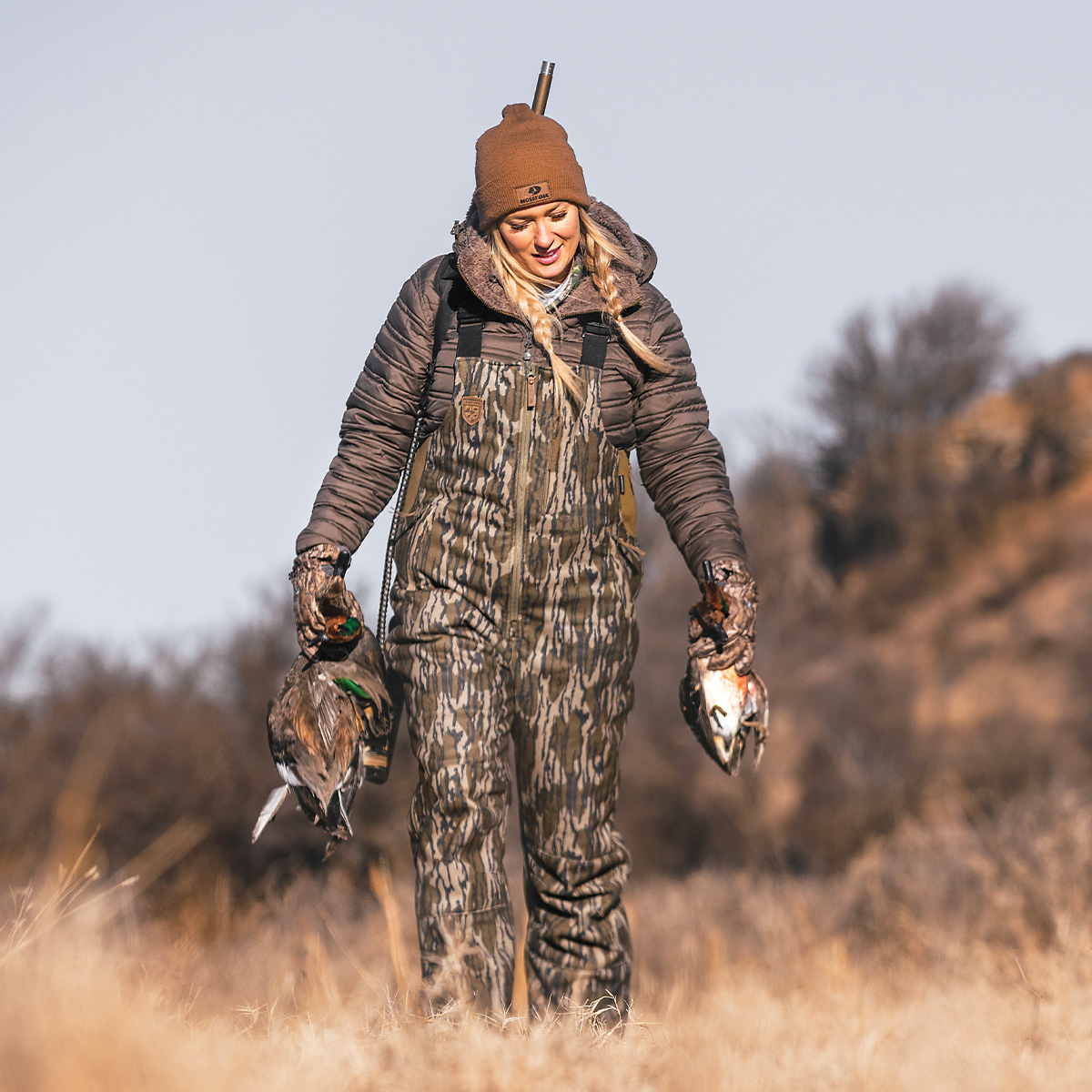 Waterfowl hunter with harvested waterfowl. Photo by Ed Wall Media