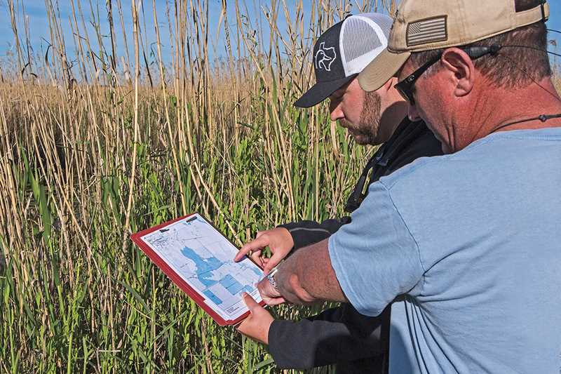 DU Biologists working to Restore wetlands to Chenier Plain photo by TODDSTEELEPHOTOART.COM