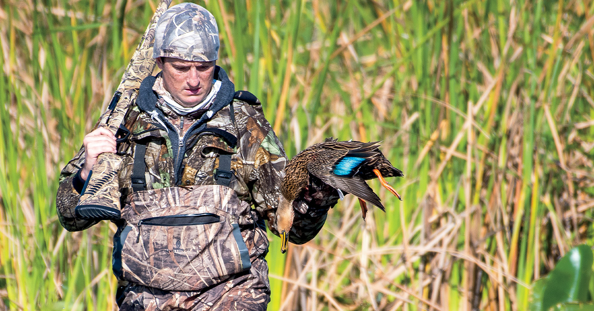 Hunter and harvested mottled duck. Photo by 6 Drakes Photography/EricOrlando