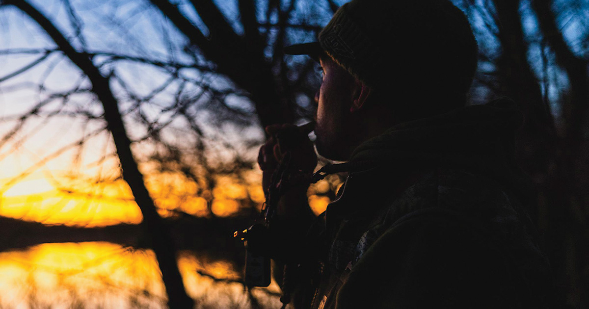 Duck hunter calling. Photo by Ed Wall Media