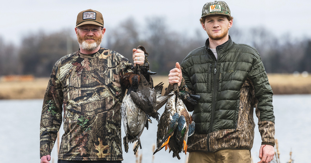 Hunters with harvested ducks. Photo by Ed Wall Media