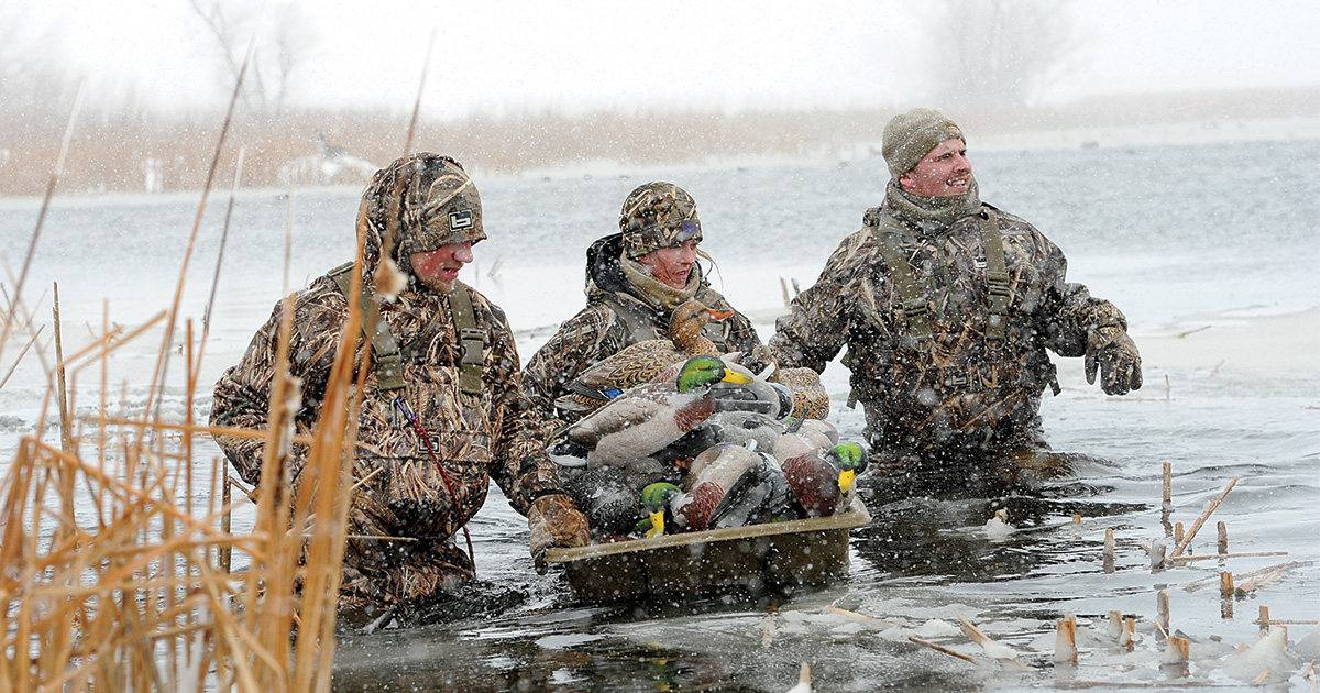 Hunters carrying decoys. Photo by Jim Thompson