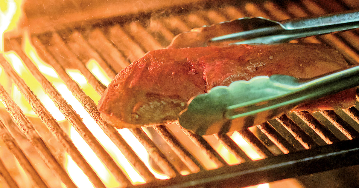 Grilling a duck breast. Photo by Brandon Amato